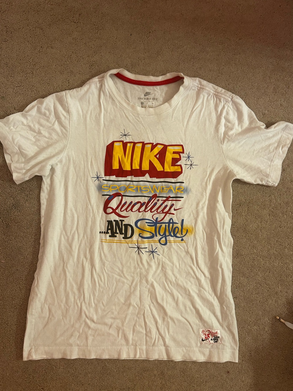 Nike White Short-Sleeve Graphic Tee with Red and Yellow Logo